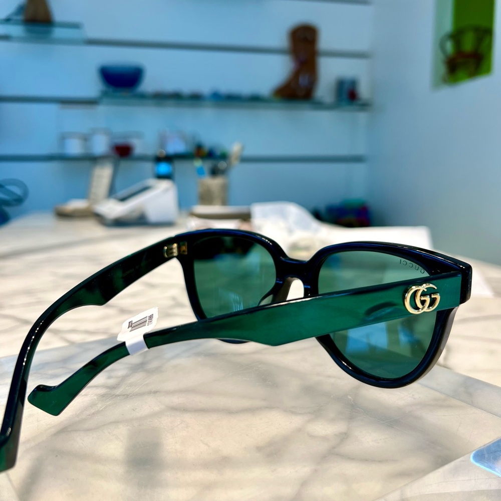 Sunglasses.  Authentic Gucci cat 3 black and pearl green